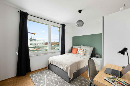 Bright double bedroom with balcony in a 4-bedroom apartment in Sendling-Westpark