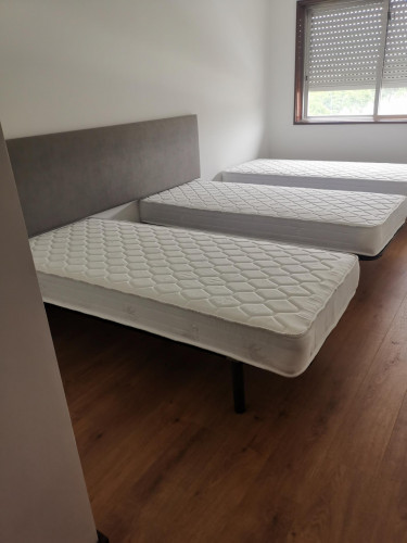Bed in a nice twin bedroom, in Ramalde