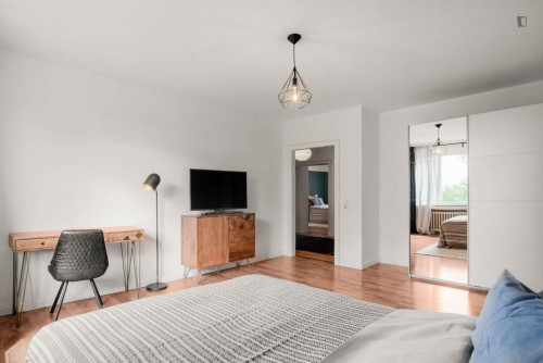 Bright and spacious double bedroom with TV