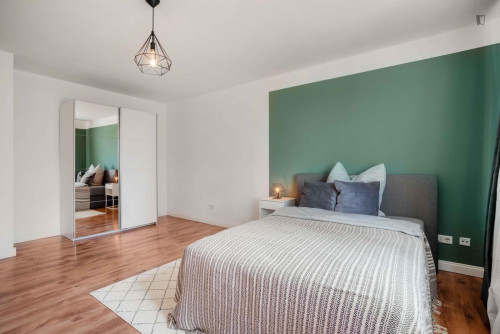 Bright and spacious double bedroom with TV