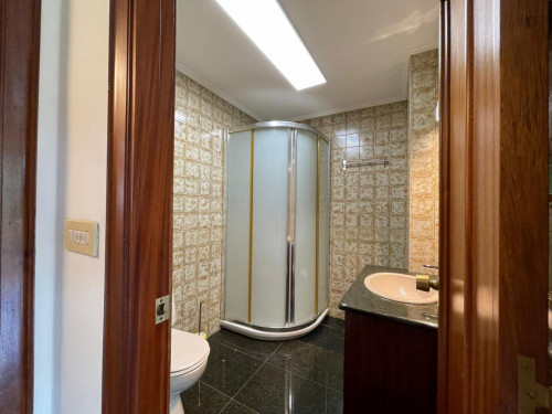 Breezy double ensuite bedroom with a balcony, near the Matiko train station