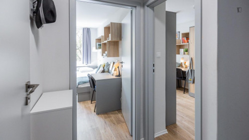 Bed in a cosy twin bedroom in a student residence, in the Płaszów area