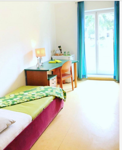 Bed in a twin bedroom, in a residence in Penzing