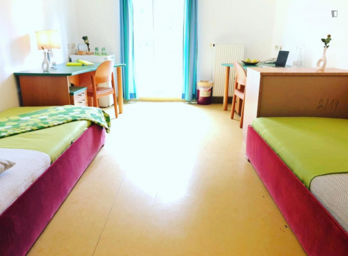 Bed in a twin bedroom, in a residence in Penzing