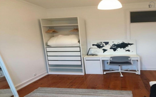 Clean bedroom in a 6-bedroom apartment near Arroios metro station