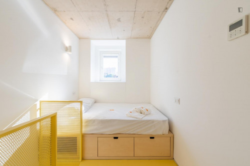 Sunny mezzanine double ensuite bedroom near the The Catholic University of Portugal