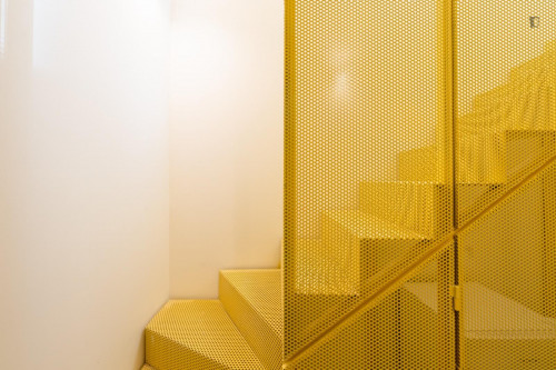 Sunny mezzanine double ensuite bedroom near the The Catholic University of Portugal