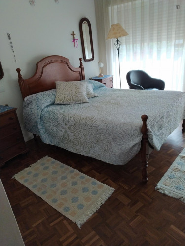Sunny double bedroom with a balcony