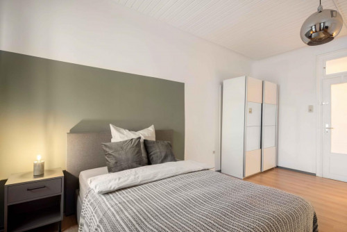 Spacious single bedroom with TV in a 3-bedroom apartment