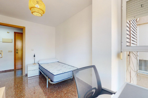 Attractive single ensuite bedroom in a property with balcony