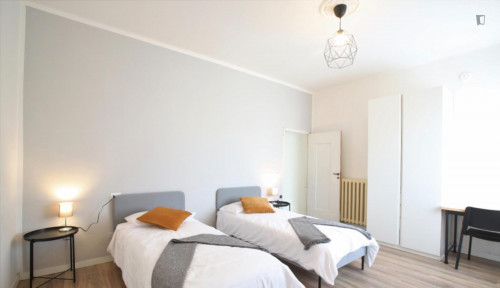 Bed in a twin bedroom near Parco Giardino Ducale Estense