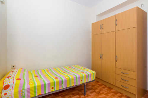 Humble single bedroom with a sunny balcony, in Campoamor