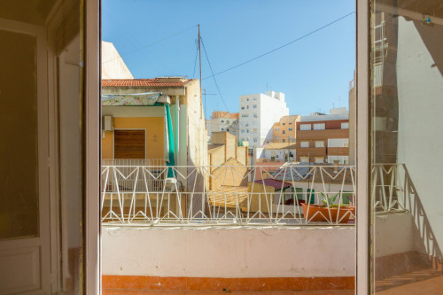 Humble single bedroom with a sunny balcony, in Campoamor