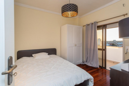 Cozy single bedroom with balcony