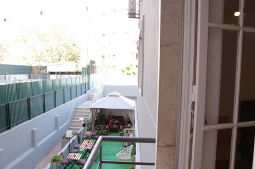 Cozy single bedroom with balcony