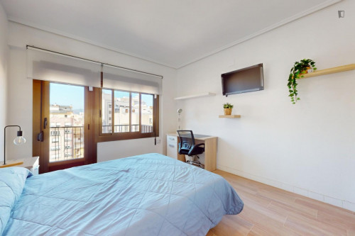 Cozy single bedroom with balcony