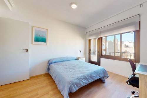 Cozy single bedroom with balcony