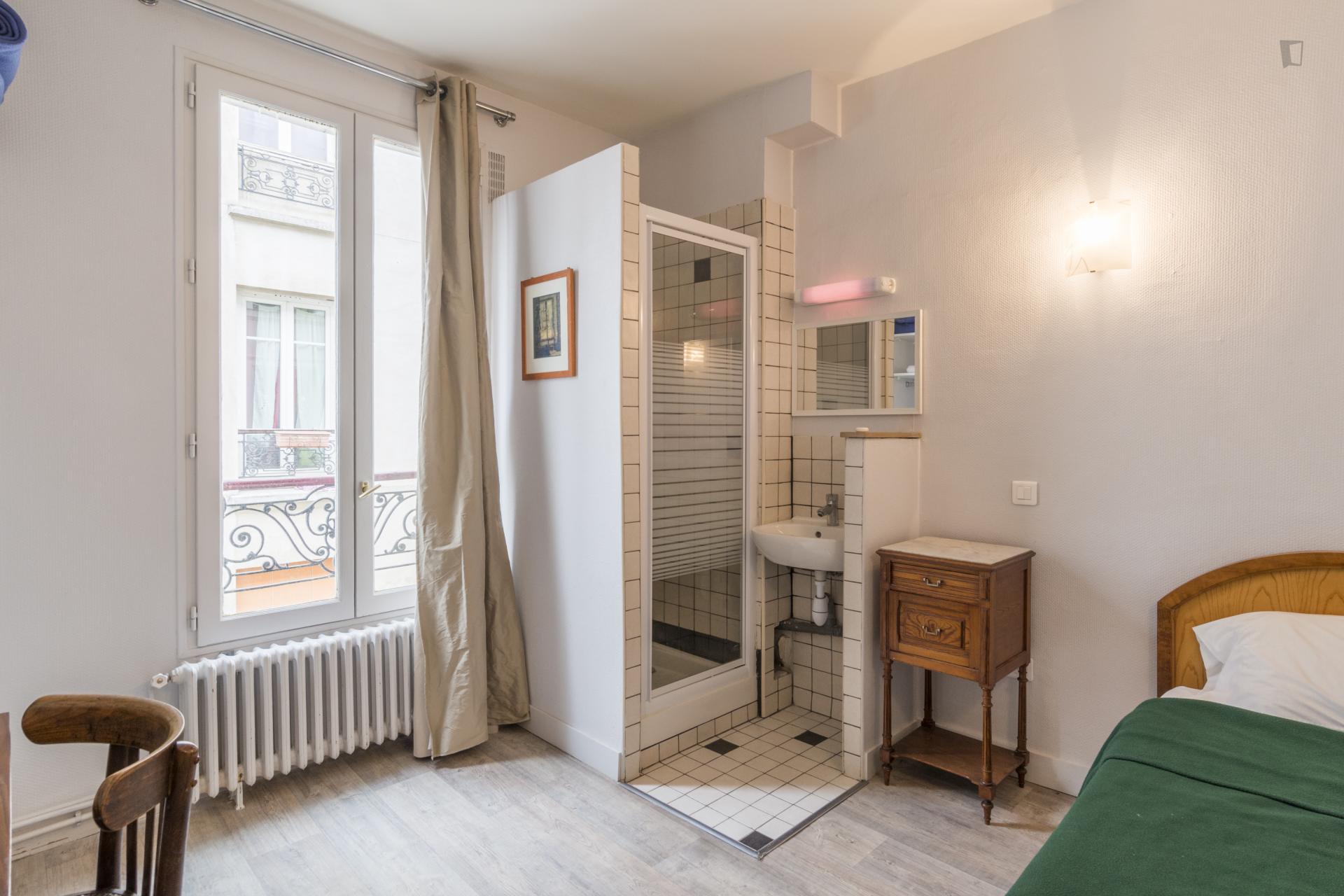 Bright single ensuite bedroom in a hotel, in the 18th arrondissement