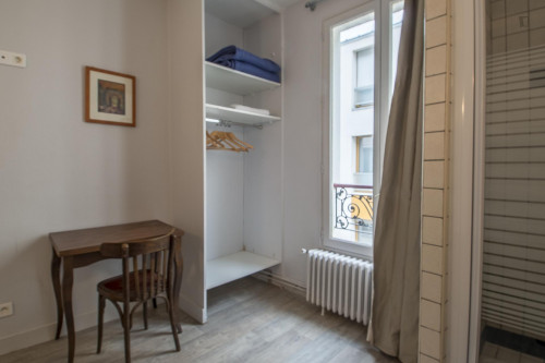 Bright single ensuite bedroom in a hotel, in the 18th arrondissement