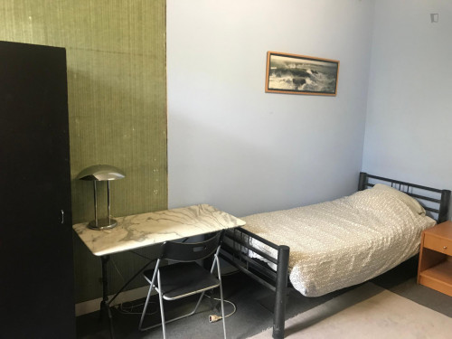 Single bed in a simple twin bedroom in a Student House