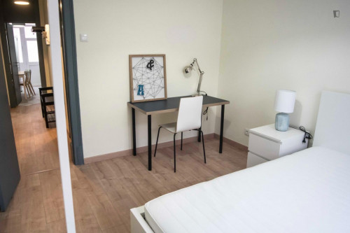 Cozy single bedroom with balcony