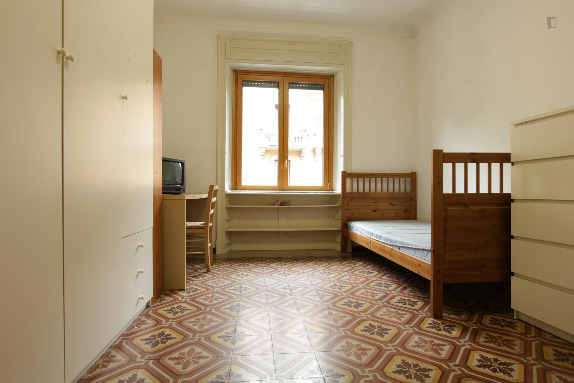 Bed in a twin bedroom in Città Studi