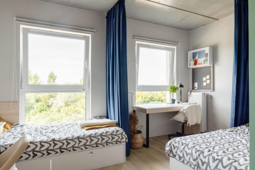 Bed in an Inviting twin bedroom Near Prince Józef Poniatowski Park