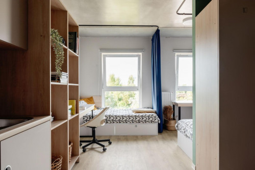 Bed in an Inviting twin bedroom Near Prince Józef Poniatowski Park