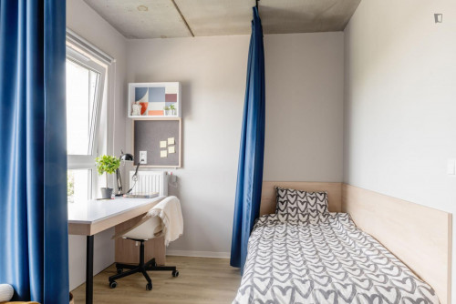 Bed in an Inviting twin bedroom Near Prince Józef Poniatowski Park