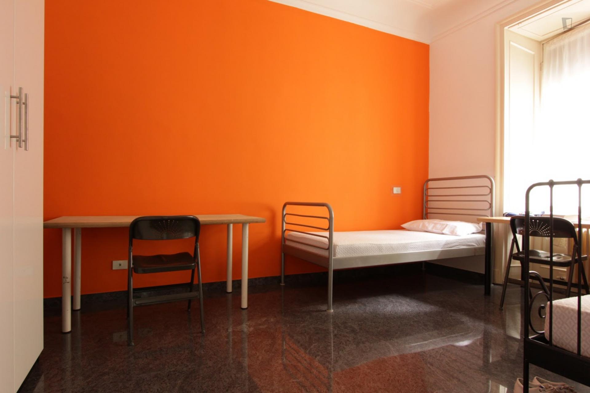 Bed in a twin bedroom, close to IED