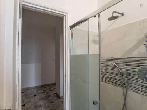 Bed in a twin bedroom connected with Cattolica University