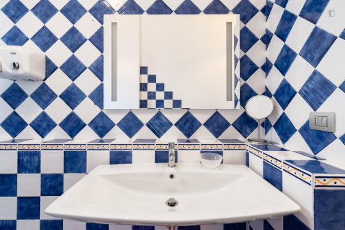 Comfortable bed in a twin bedroom with private bathroom