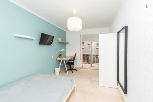 Cozy single bedroom with balcony