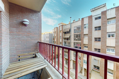 Cozy single bedroom with balcony