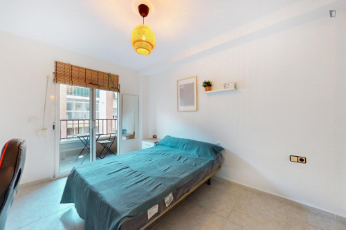 Cozy single bedroom with balcony