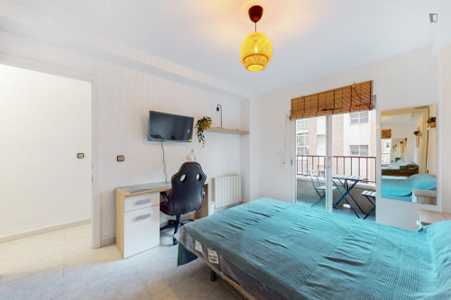 Cozy single bedroom with balcony