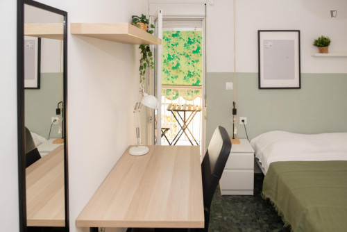 Cozy single bedroom with balcony