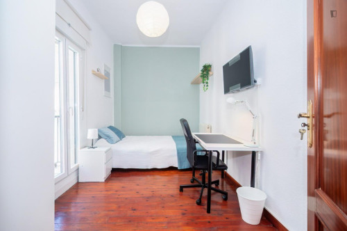 Cozy single bedroom with balcony