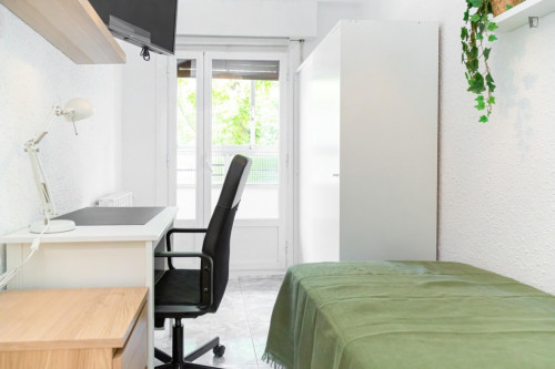 Cozy single bedroom with balcony