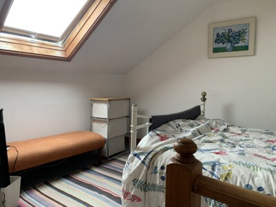 Airy attic room with posh bathroom