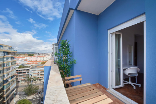 Comfortable bedroom with private balcony in a 5-bedroom apartment in Rua Eugénio de Castro - Room 4