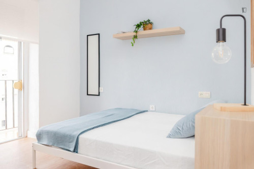 Cozy single bedroom with balcony