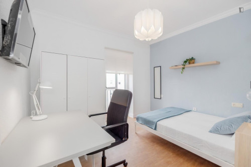 Cozy single bedroom with balcony