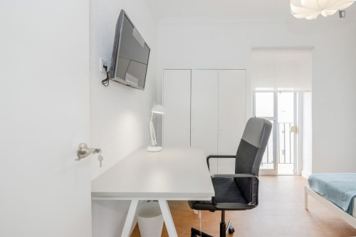 Cozy single bedroom with balcony
