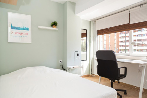 Cozy single bedroom with balcony