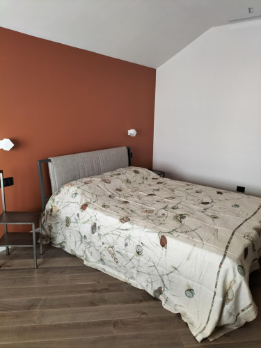 Comfortable double bedroom with private bathroom in a modern apartment