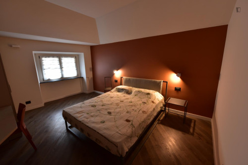 Comfortable double bedroom with private bathroom in a modern apartment