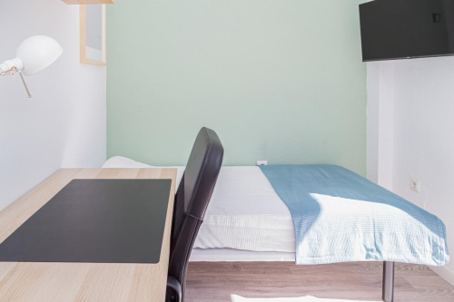 Cozy single bedroom with balcony