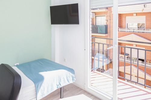 Cozy single bedroom with balcony