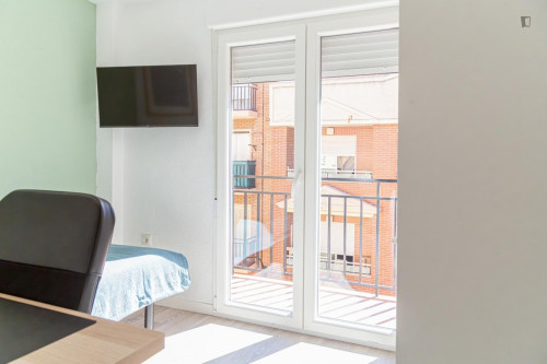 Cozy single bedroom with balcony